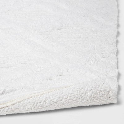  Diamond Embossed Tasseled Woven Bath Rug White - Threshold™